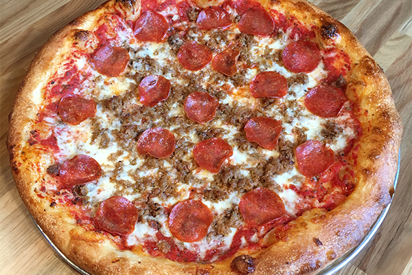 the beefeater pizza with Amici tomato sauce, ground chuck, mozzarella, Italian sausage and pepperoni