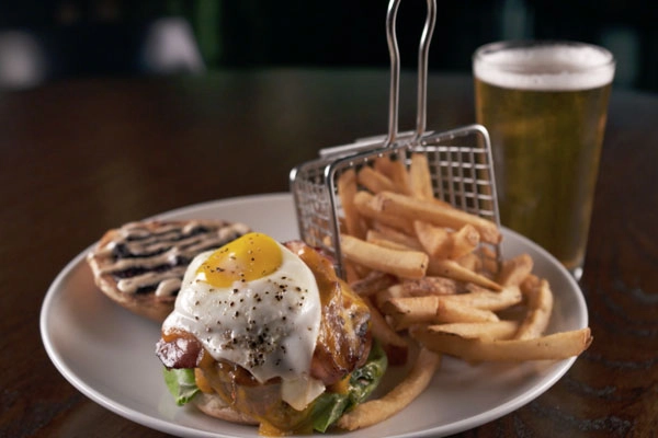 Southern Burger with fries from Todd English Tavern