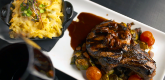 Apple brined porkchop from Secreto Southern Kitchen and Bar