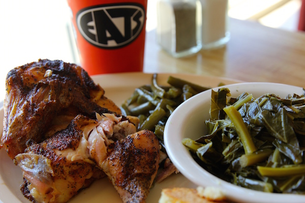 Eats' famous lemon pepper chicken with collard greens and green beans.