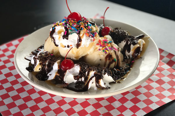 Banana split with caramel, hot fudge, and strawberry sauce from Kirby G's diner