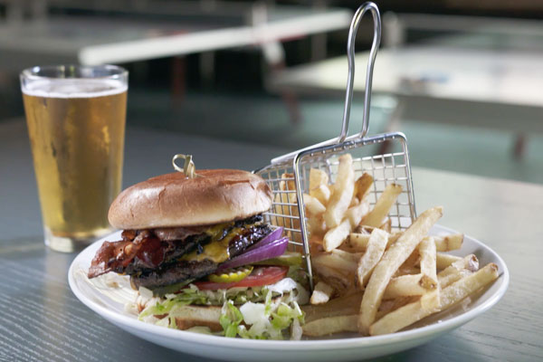 Bacon three way burger with fries from Sports and Social 