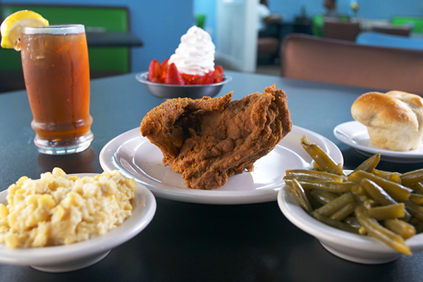 Magnolia Room's fried chicken with mac and cheese, green beans, and other sides.
