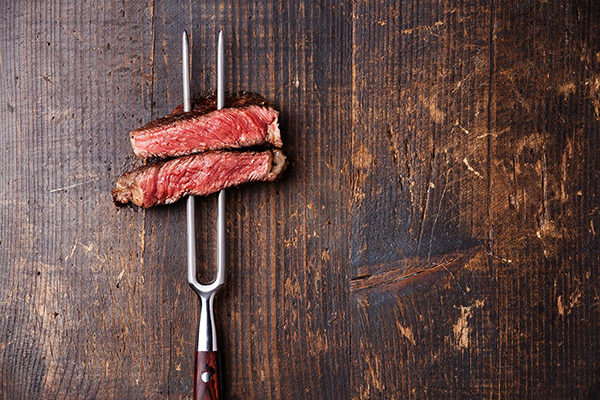 steak on a fork from arnette's chop shop