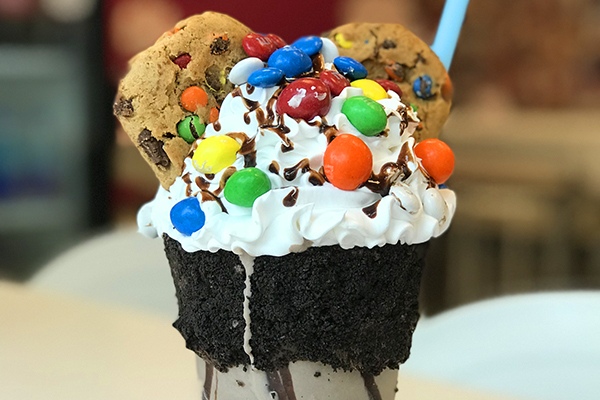 a chocolate shake from cheesecaked topped with M&M's