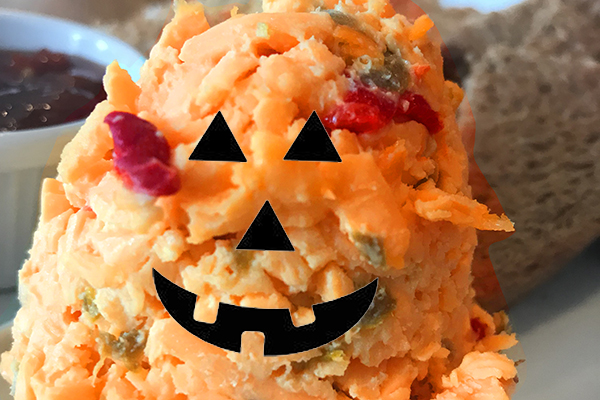Pimento Cheese with a Jack-O-Lantern face on it