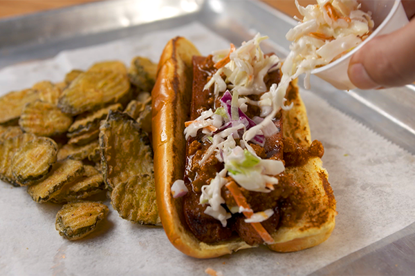 Hot dog with slaw and chili from Village Burger