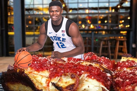 zion williamson looks at a pizza from Nina + Rafi