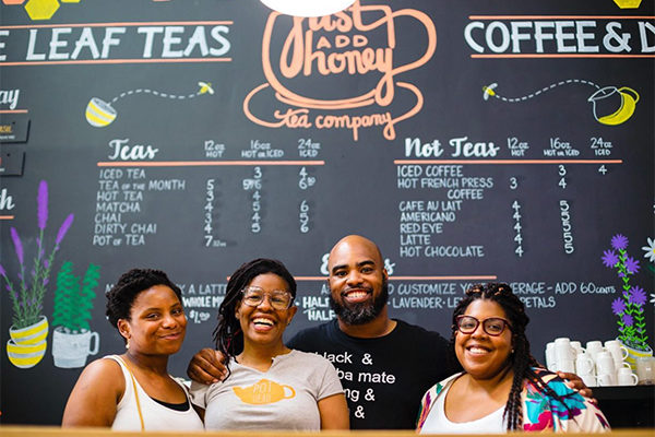 Just Add Honey Tea Interior, showing the team in our black-owned restaurants in Atlanta article | Photo: Facebook/justaddhoney