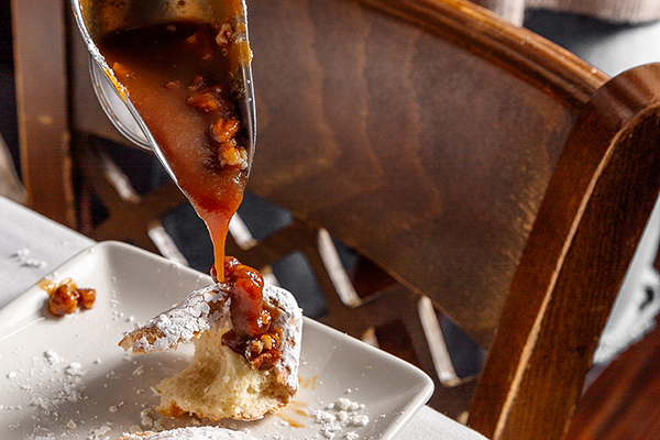 Beignets with Praline caramel sauce from Hugo's Oyster Bar in Roswell, GA