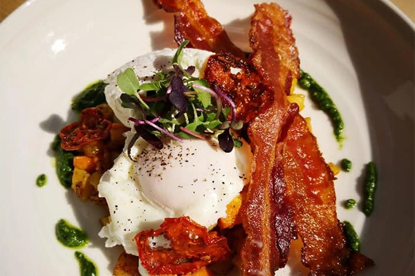 Cupanion's - Eggs, Hash, Kale, Bacon, Pesto | Photo: Facebook/cupanions