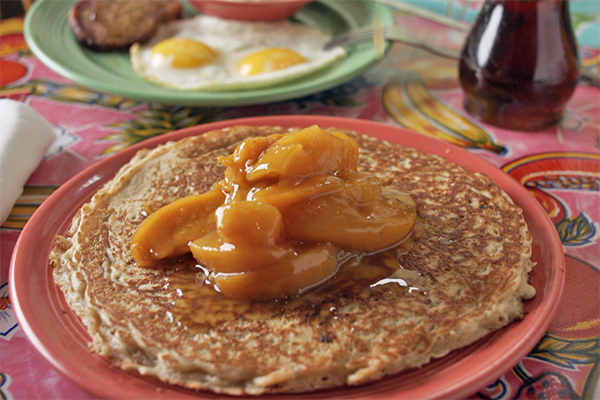 Oatmeal Pancakes with Warm Peach Compote from Flying Biscuit
