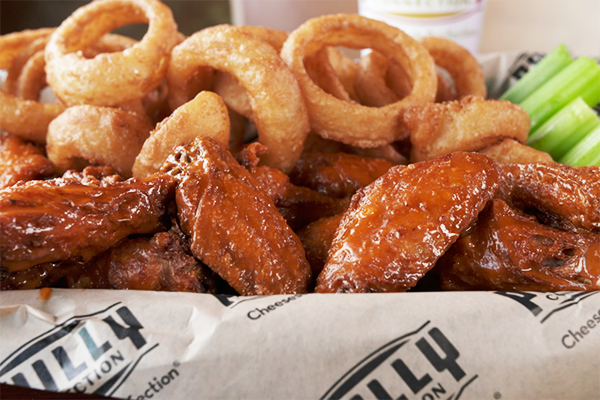 Buffalo wings and onion rings from The Philly Connection