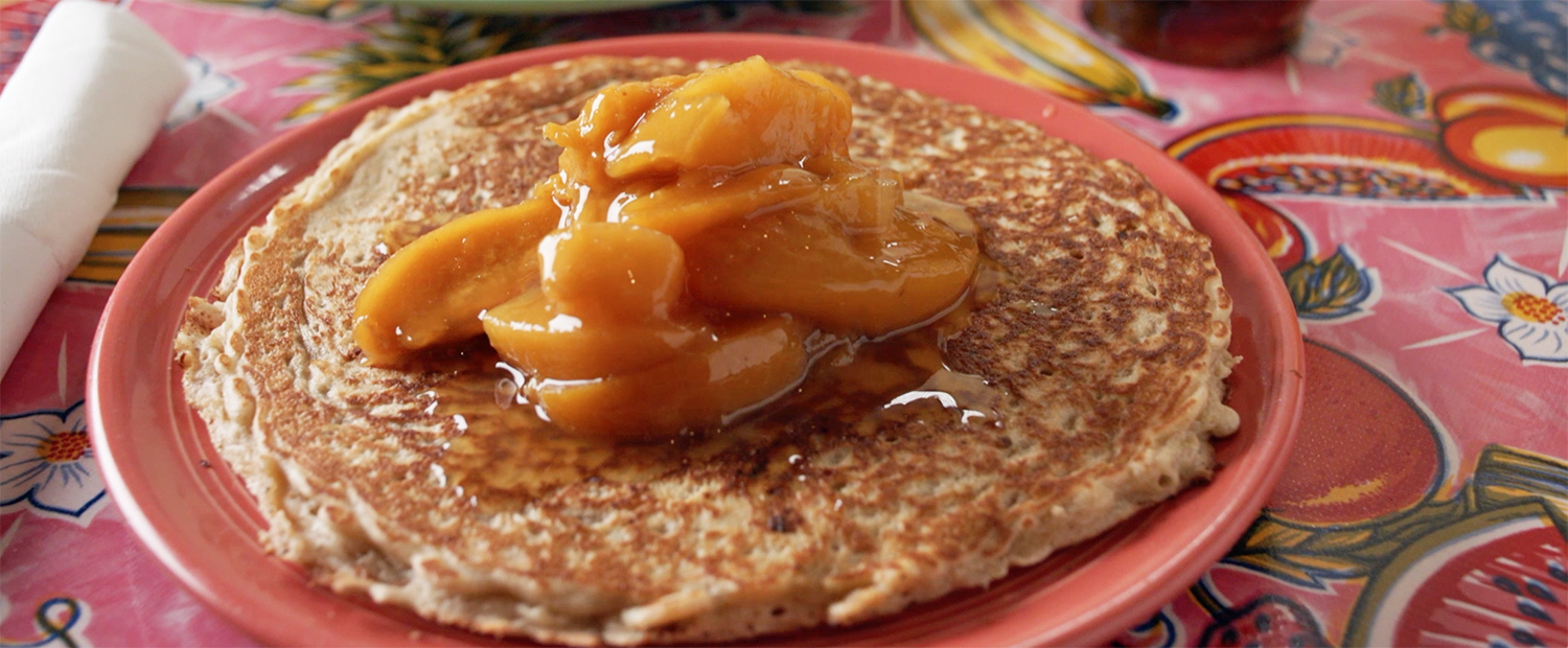Organic Oatmeal pancakes with warm peach compote from The Flying Biscuit Cafe