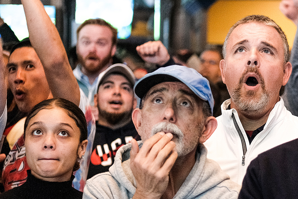 Fans watch a game in shock at Fado.