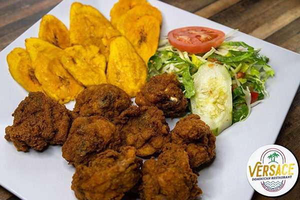 Fried plantains and chicken from Versace Dominican Restaurant.