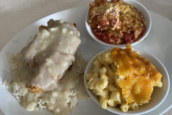 Smothered chicken, mac and cheese, tomato pie