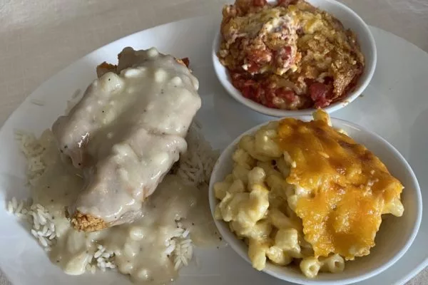 Smothered chicken, mac and cheese, tomato pie