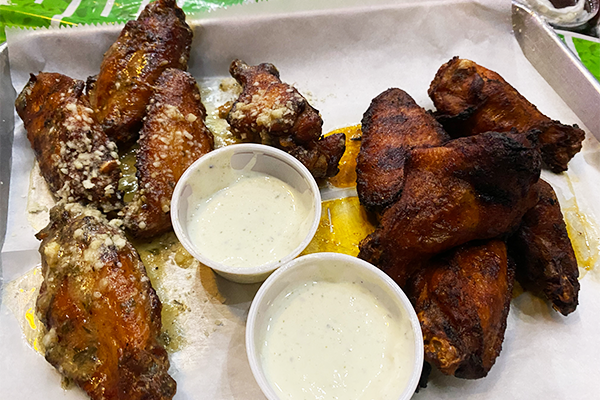 Smoked wings with various sauces and ranch dipping sauce