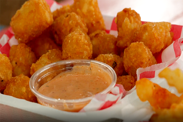 Tater tots with dipping sauce from NFA Burger