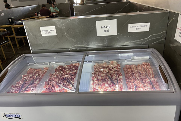 Fridge full of fine meat selections at Hot Pot Times | Photo: Yelp
