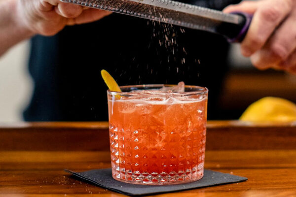 A cocktail being garnished at The Alden in Chamblee.