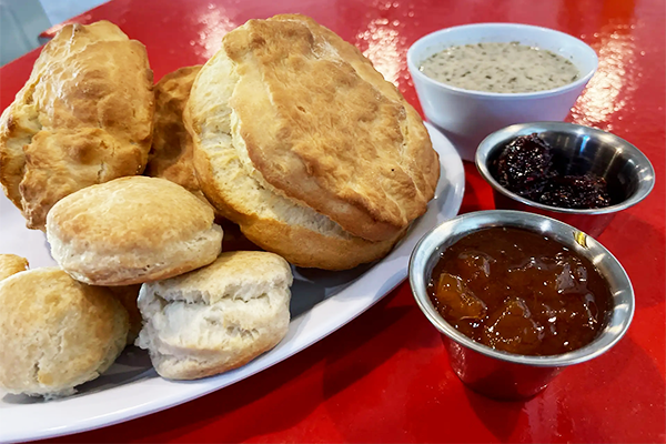 Biscuits with jelly, butter, and gravy