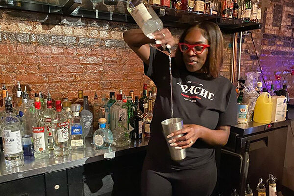 A bartender makes a cocktail at Apache XL.