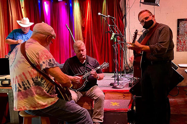 Musicians warm up before an act at Red Light Cafe.