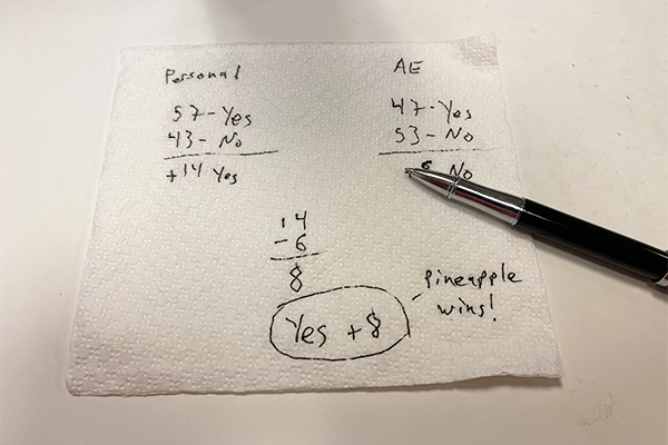 A white napkin with scribblings in blank ink