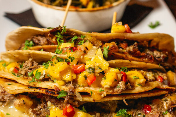 Confit & pulled duck tacos with peach salsa.