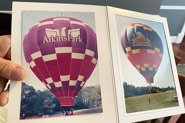 Two photos of hot air balloons, one saying "Atkins Park" and the other saying "Charley's Restaurants"