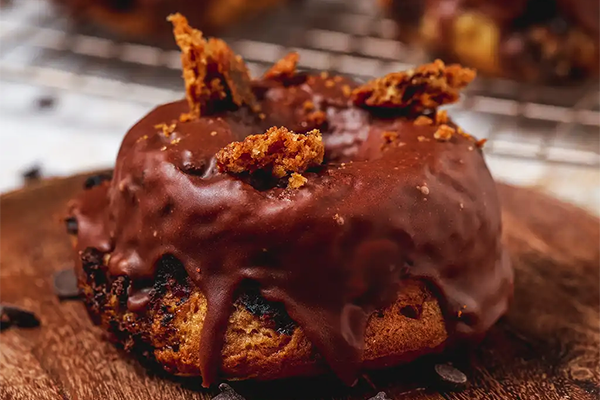 Donut with chocolate frosting and cookie crumbles on top