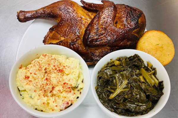 Half a smoked chicken and sides from Crazy Ron's BBQ in Stone Mountain, GA.