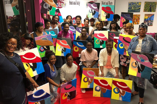 Patrons show off their art from Living Color in Sandy Springs.