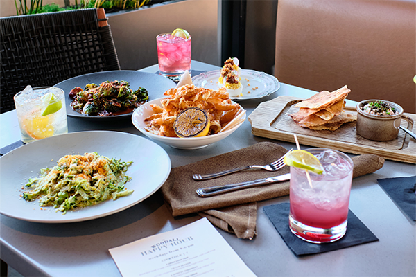 A table full of different dishes and drinks