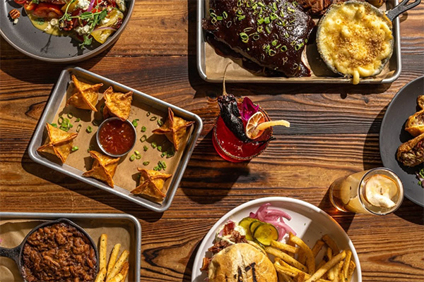 multiple dishes from sweet auburn bbq | 656 North Highland Avenue Northeast, Atlanta, GA 30306